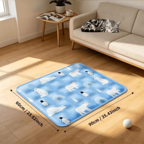 The blue patterned cooling mat on a living-room floor with an illustrated 90 by 60 centimeter size.