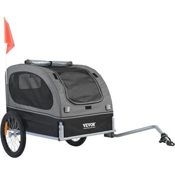 Gray and black two-wheel dog bicycle trailer with mesh windows, safety flag, rolled clear cover and bicycle coupler.